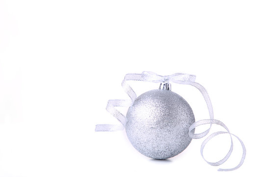 Silver Christmas ball with ribbon on white background