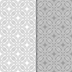 Gray and white geometric ornaments. Set of seamless patterns