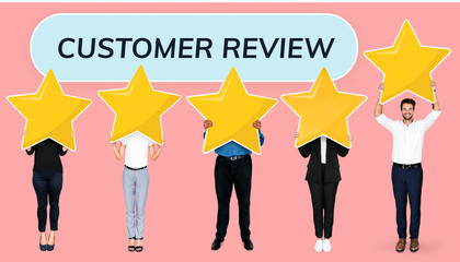 Diverse businesspeople showing golden star rating symbols