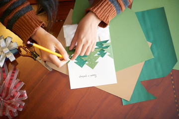 Process of making greeting card for Christmas celebration