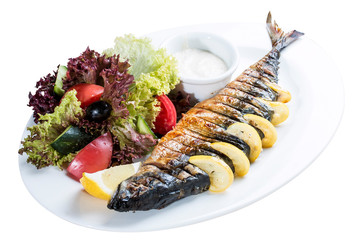 Mackerel baked with lemon. On a white plate