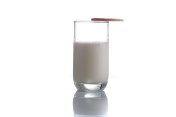 fresh milk in the glass on white background with cookies, isolated