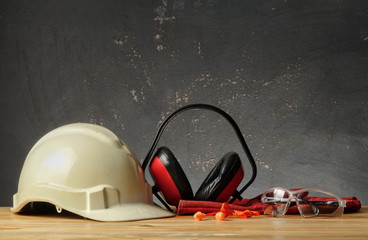 Safety Personal Protective Equipment(PPE) on a rustic black background. - 230952803