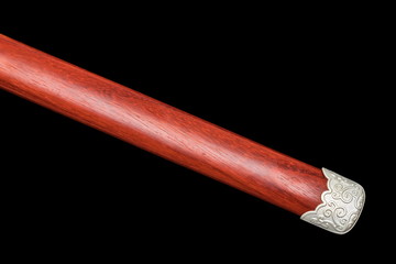 Wooden  scabbard of Chinese sword  isolated in black background.