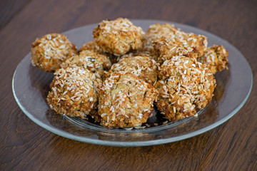 Homemade oatmeal cookies with coconut chips, muesli, dried apricots and other delicacies. Sweet and healthy snack,