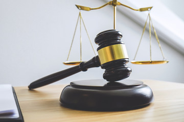 Scales of justice and Gavel on sounding block, object and law book to working with judge agreement...
