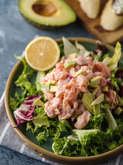Ceviche is a traditional dish from Peru. Salmon marinated in lemon with fresh lettuce, avocado and onions