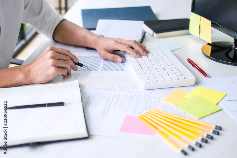Poster businessman working writing making note business plan and graphic designer with computer in office