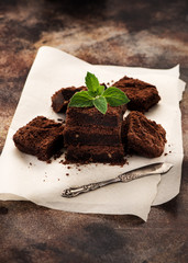 homemade chocolate brownies on a brown concrete background