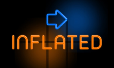 Inflated - orange glowing text with an arrow on dark background