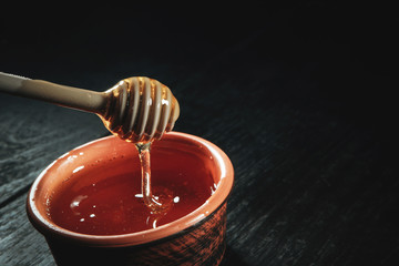 honey poured into a jar