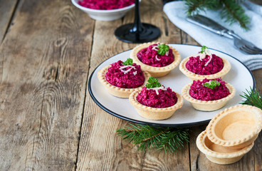 Tartlets with beetroot and cheese on a plate