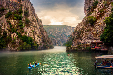Fototapeta Canyon Matka near Skopje with people kayaking and amazing foggy scenery obraz