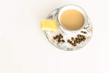 coffee, black or with milk, in a Cup, on a saucer is cheese  