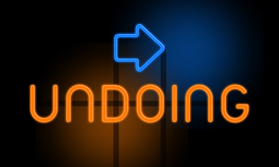 Undoing - orange glowing text with an arrow on dark background