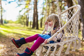 Cute girl in colorful hammock