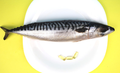 Oily fish mackerel and (or) food supplement omega-3 in capsules. Concept of choice
