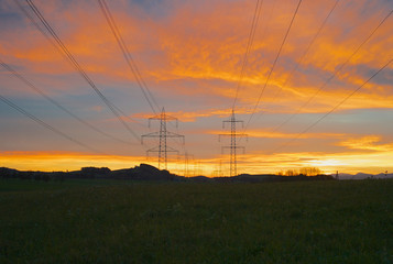 Fototapeta na wymiar Electric Power Pylons in Beautiful Morning Light