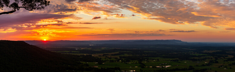 Sunset at Hunter Lookout, Watagans, Australia. Sun reflecting off beautiful cloud formation.