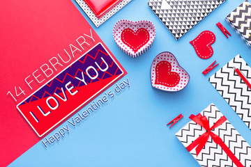 Person holding a present for Saint Valentine's day in his hands. Beautiful colorful background to st. Valentine day. Greeting card with red hearts. Wedding's invitation. Love expression. 