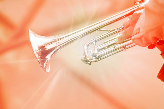 Trumpeter plays the golden trumpet.