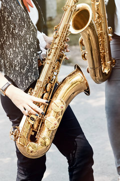 Girls playing wind instruments