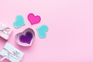 Person holding a present for Saint Valentine's day in his hands. Beautiful colorful background to st. Valentine day. Greeting card with red hearts. Wedding's invitation. Love expression. 