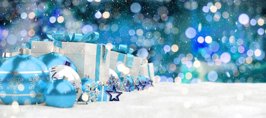 Blue christmas baubles and gifts lined up 3D rendering