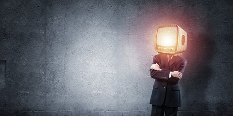 Businessman with old TV instead of head.