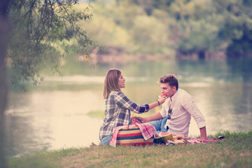 Couple in love enjoying picnic time