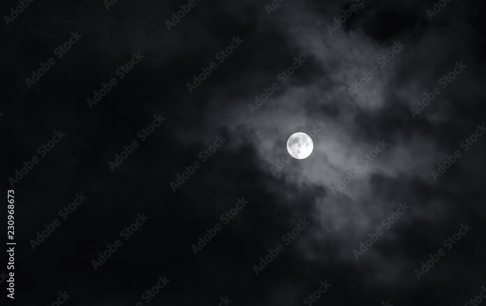 Wall mural full moon with dark clouds in the night sky