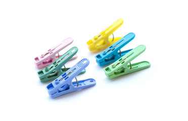 Pile of colorful clothespins isolated on white background