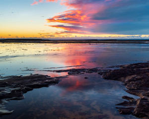 Sunrise at Long Reef Point, Australia. Epic colours and cloud formation on the Northern Beaches of Sydney.
