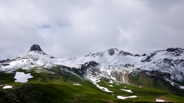 late autumn mountain landscape in Switzerland with the high peaks covered in first snow