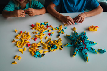 kids making origami crafts with paper, learning activities