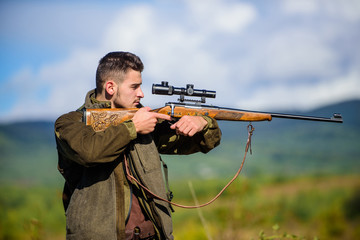 Hunting weapon gun or rifle. Masculine hobby activity. Hunting target. Man hunter aiming rifle...