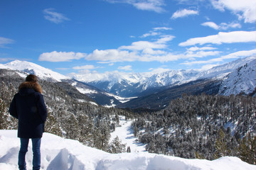 Man watching Swiss National Park in wintertime, Switzerland