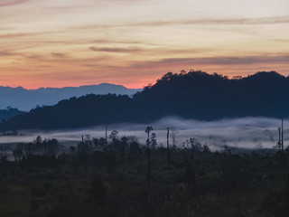 Sunrise in the mountains with mist below