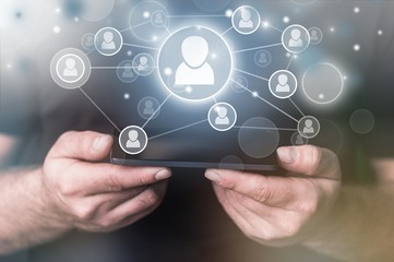 Human hand showing icons network on background