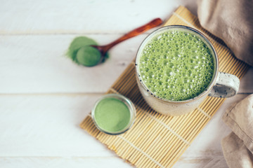 Vegan coconut matcha latte. Powdered green tea latte