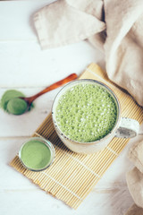Vegan coconut matcha latte. Powdered green tea latte
