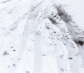 Traces of cars in the snow as a background