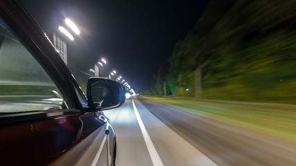 Obraz na płótnie Canvas Drivelapse from Side of Car moving on a night highway timelapse hyperlapse