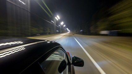 Plakat Drivelapse from top Side of Car moving on a night highway timelapse hyperlapse