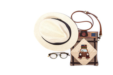 Women fashion travel vintage style, Shoulder bag, straw hat and glasses on white background, top view.