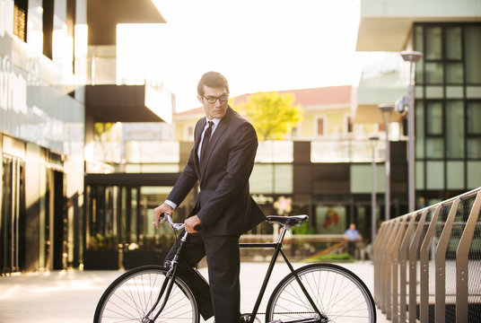 Businessman cycling outdoors