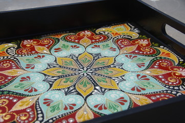 black square hand-painted tray with contour acrylic paints in the technique point to point, with a geometric pattern in the form of a mandala