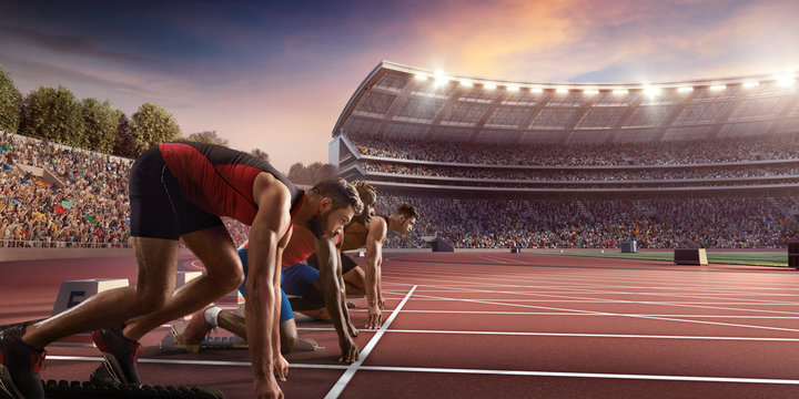 Male athletes sprinting. Three men in sport clothes on starting line prepares to run at the running track in professional stadium