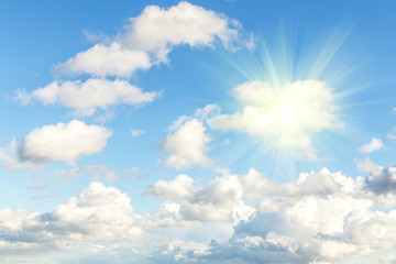 Blue sky with clouds and sun, sunlight, rays