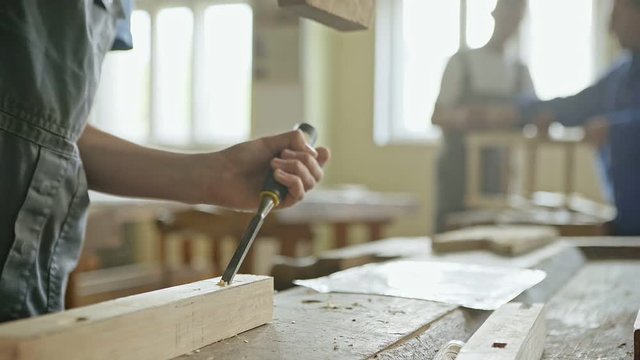 Man with chisel and hammer 